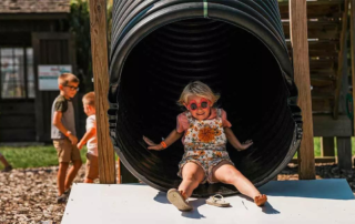 blonde girl on slide